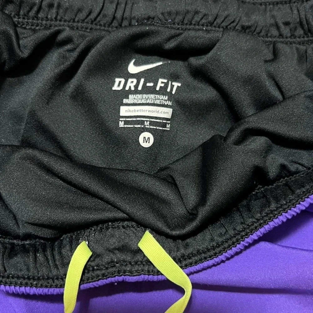Nike Dri-Fit purple shorts with neon yellow trim 311.5